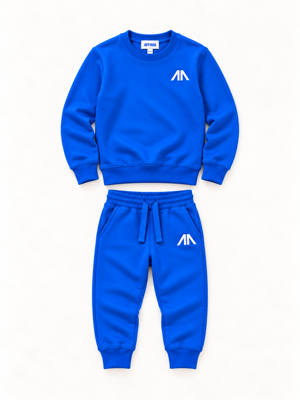 Flat lay kinder trainingspak blauw